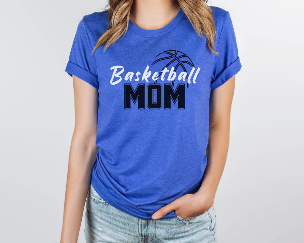 Blue basketball mom shirt with 'Basketball' in white letters, 'Mom' in black letters, and a basketball outline above the word 'Basketball.