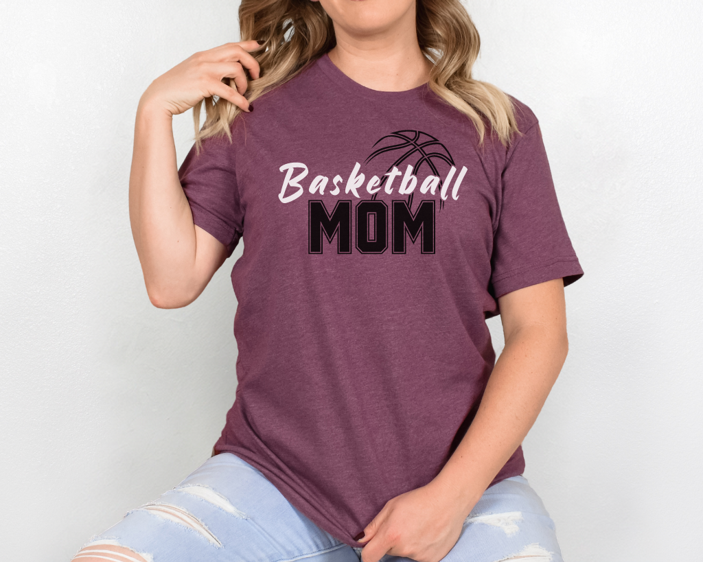 Maroon basketball mom shirt with 'Basketball' in white letters, 'Mom' in black letters, and a basketball outline above the word 'Basketball.