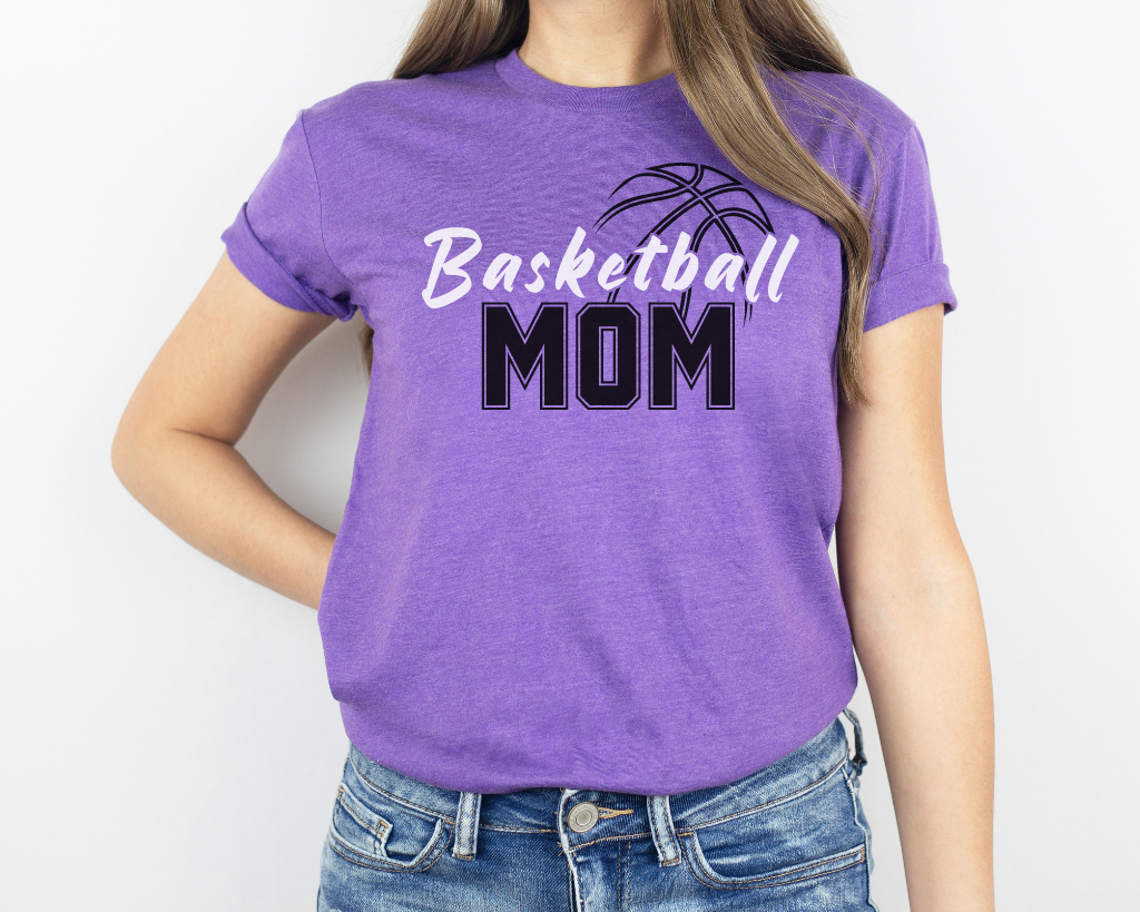 Purple basketball mom shirt with 'Basketball' in white letters, 'Mom' in black letters, and a basketball outline above the word 'Basketball.