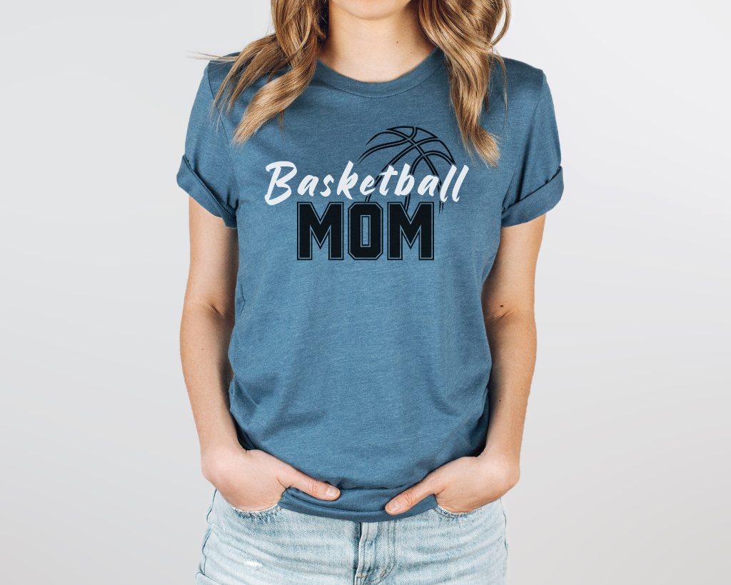 Teal basketball mom shirt with 'Basketball' in white letters, 'Mom' in black letters, and a basketball outline above the word 'Basketball.