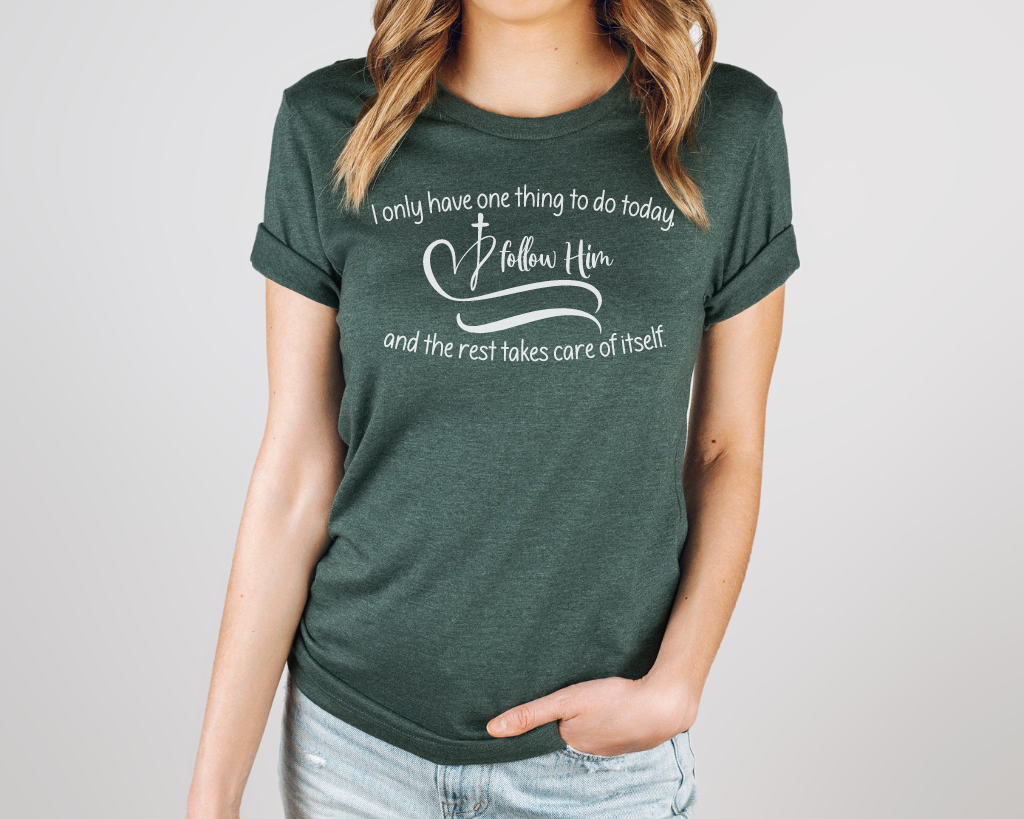 Christian green shirt white lettering "I only have one thing to do today, follow him, and the rest takes care of itself" with white heart & cross