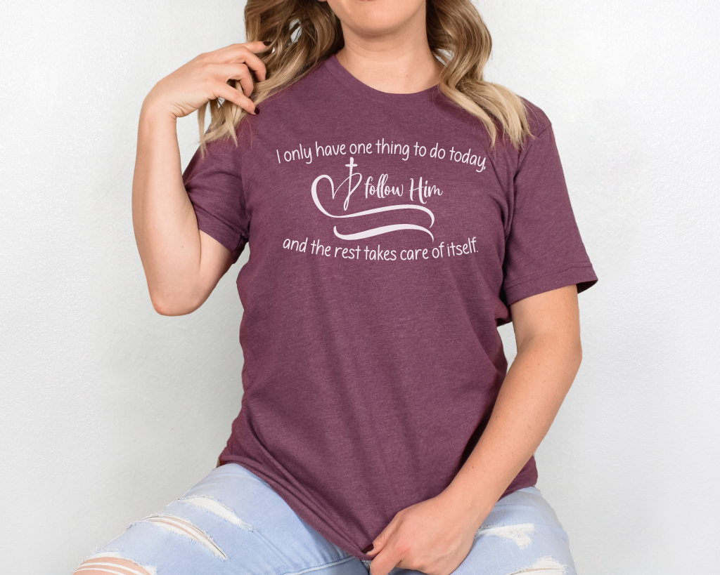 Christian maroon shirt white lettering "I only have one thing to do today, follow him, and the rest takes care of itself" with white heart & cross