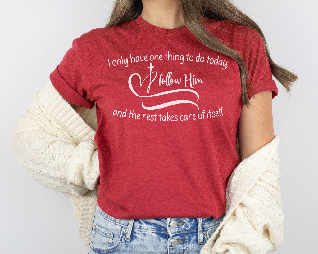 Christian red shirt white lettering "I only have one thing to do today, follow him, and the rest takes care of itself" with white heart & cross